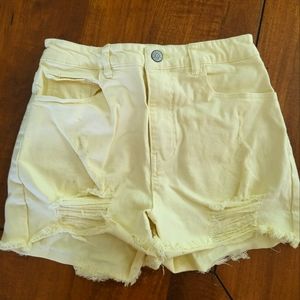 Mid-rise Yellow Distressed Shorts